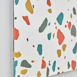 Terrazzo Rectangular Printed Glass Wall Mirror 120cm, frameless rectangular mirror with red, teal, ochre and grey terrazzo chips printed on the silvered glass edge, shown against a plain white wall.