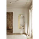 Gallery Gold Leaf Arch Top Wall Mirror 170cm, a frameless arched mirror with a hand-applied gold leaf band along one edge, mounted in a hallway with panelled doors and wood flooring reflected.