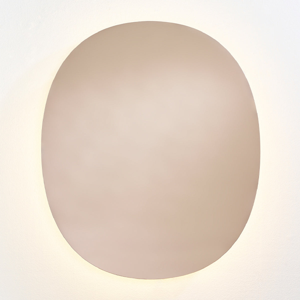 Brio Bronze backlit LED oval wall mirror, 106cm, bronze-tinted glass with a warm LED halo washing onto the wall behind it.