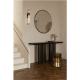Ray Powder Coated Round Wall Mirror 105cm in Gold, hung above a dark console table in a hallway, its edge ringed by small gold discs reflecting within the glass.