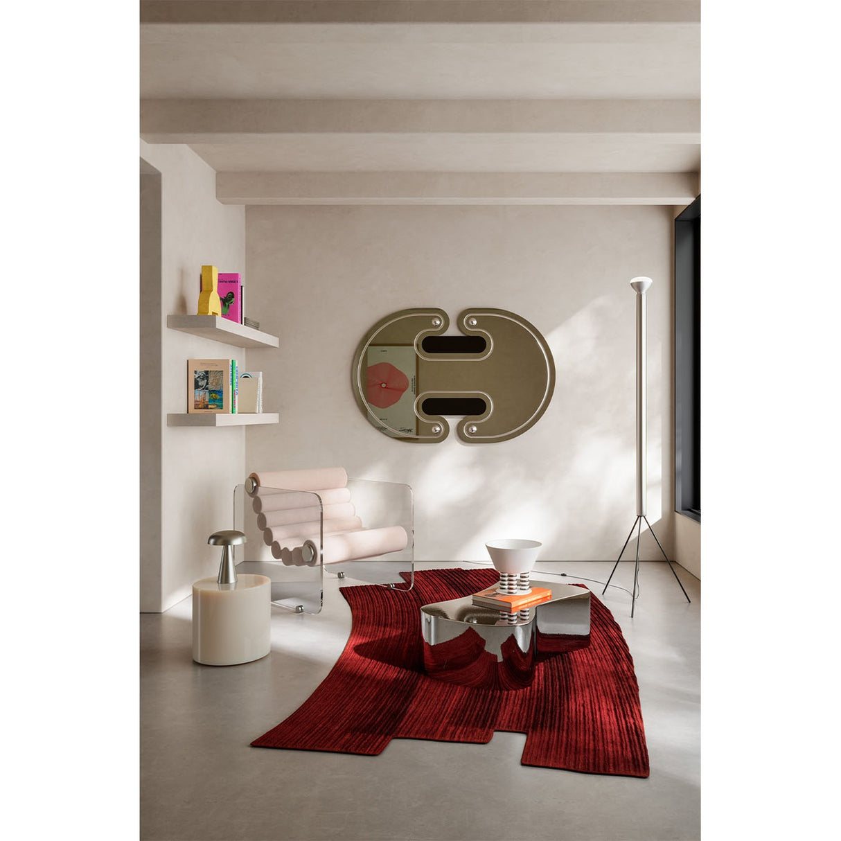 Oval silvered wall mirror with black lacquered ellipse detail and silver-leaf sphere accents, 150cm, mounted above a console in a neutral living room.