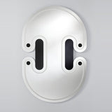 The mirror seen larger, the twin lobed outline with the engraved slots and spheres set across the face.