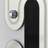 Close-up of the Satellite Silver Leaf Engraved Orbit Wall Mirror, showing a chrome half-sphere and black lacquered glass ellipse set into the silvered, curved frame.