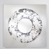 The square mirror turned slightly, the poured ring standing out against the flat industrial silvering behind it.