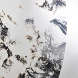 Close-up of the poured silvering, the metal clouding into patterns in black and brown across the ring.