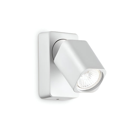 The Sparkeon-2 Single Spotlight in white is a contemporary square wall light featuring adjustable lighting with a cylindrical spotlight. The fixture's spotlight is installed on a rectangular base, perfect for targeted illumination. When turned on, it emits a soothing glow.