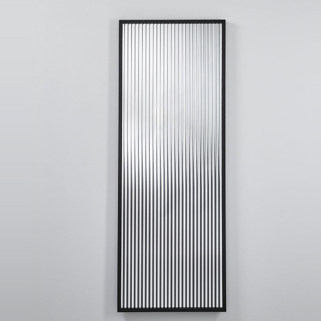 Wall mirror of vertical clear, silvered and black printed strips held in a slim black oak frame.