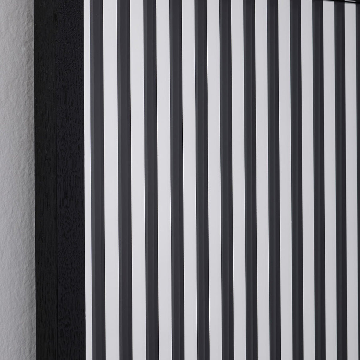 Close-up of the vertical strips, the black bands alternating with clear and silvered glass.