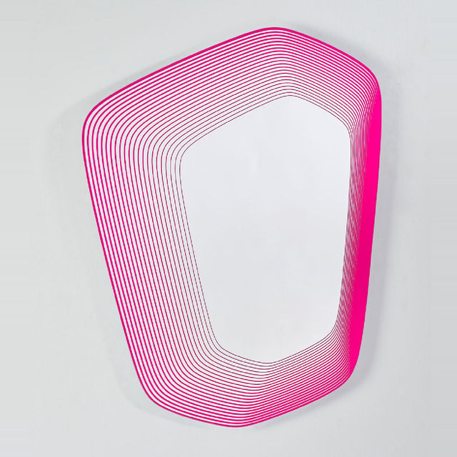 Vibe Pink irregular wall mirror with concentric magenta line print fading into the glass, frameless design on a plain light grey background.