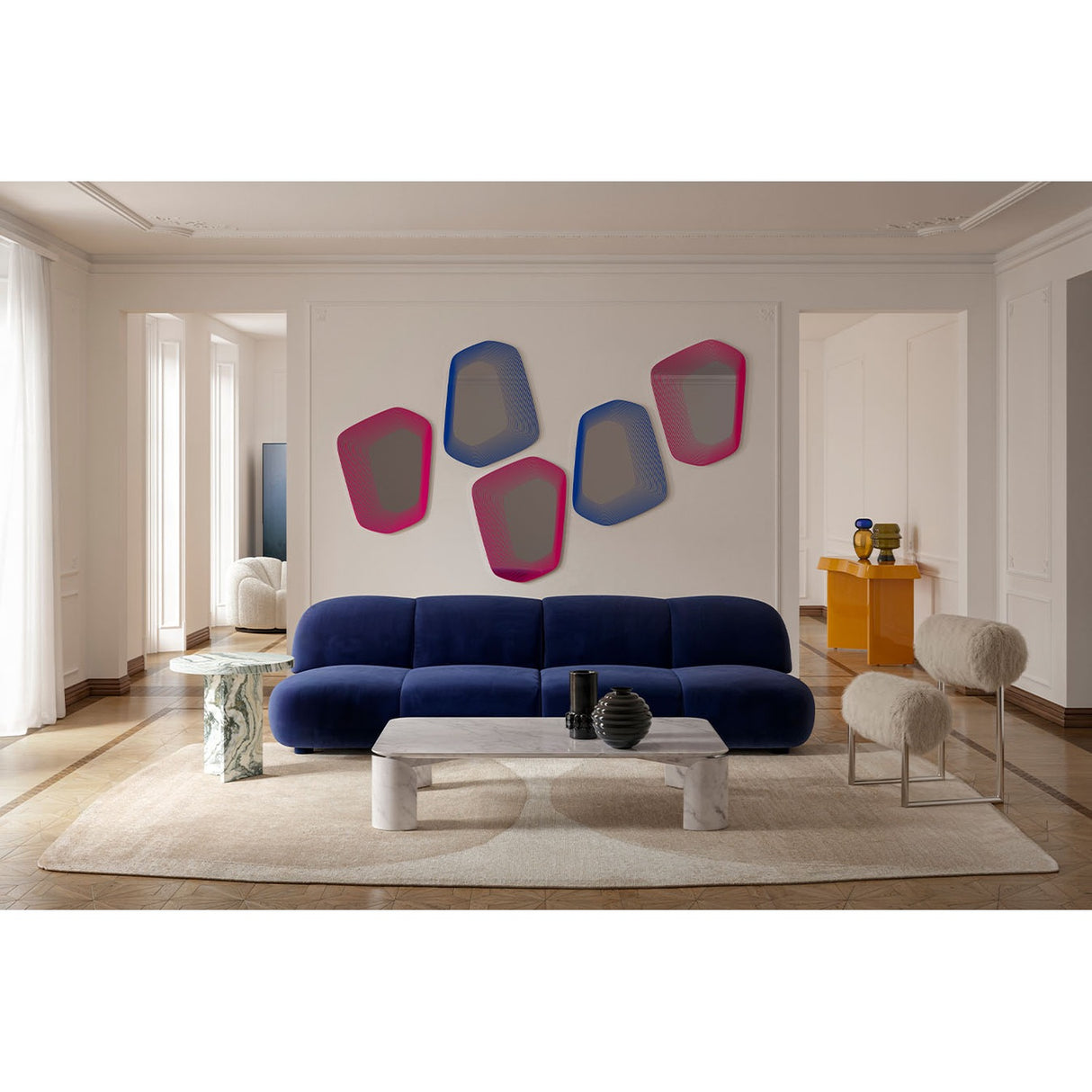 Vibe Pink Line Print Irregular Wall Mirror 80cm, one of five frameless mirrors with pink and blue gradient outlines, arranged on a wall above a navy sofa in a living room.