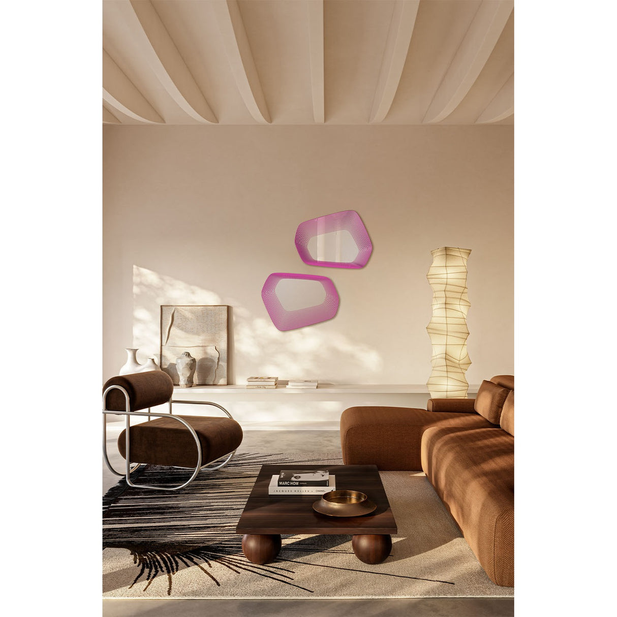 Two Vibe Pink irregular wall mirrors with concentric magenta line prints on frameless glass, displayed on a wall above a sideboard in a living room setting.