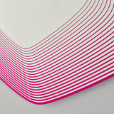 Close-up of the Vibe Pink Line Print Irregular Wall Mirror, showing concentric magenta lines curving on frameless glass against a plain light background.