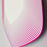 Close-up of the Vibe Pink Line Print Irregular Wall Mirror, 80cm, showing concentric magenta lines printed on glass in a frameless, curved corner design.