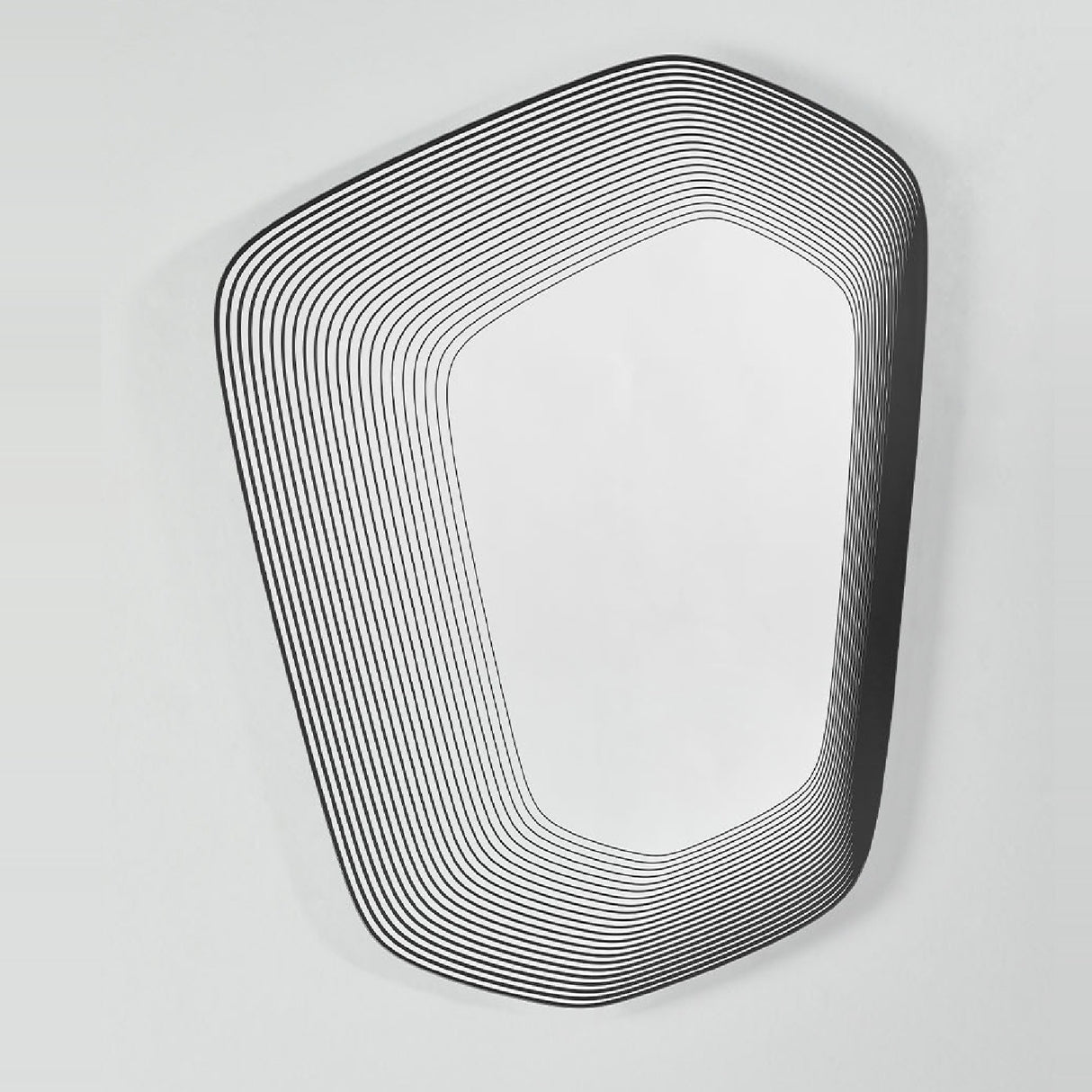 Vibe Black Line Print Irregular Wall Mirror 80cm, an irregular-shaped frameless mirror with concentric black lines printed on the glass, shown on a plain white wall.