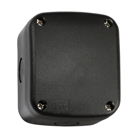 The product named "IP66 Outdoor Enclosure, Small - Black" is a square electrical enclosure made of black plastic with rounded edges and four screws on the front. It is labeled IP66, signifying its waterproof and dustproof capabilities, making it ideal for outdoor wiring solutions. The enclosure features a sleek, matte finish.