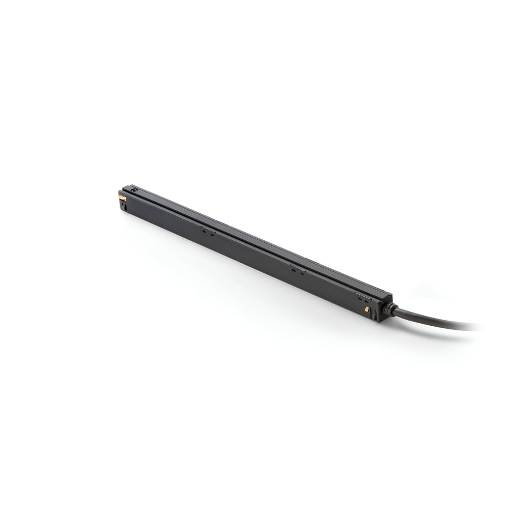 A sleek, long, and thin black Luxeon Constant Voltage Magnetic LED Driver with a cable extending from one end rests on a plain white background.