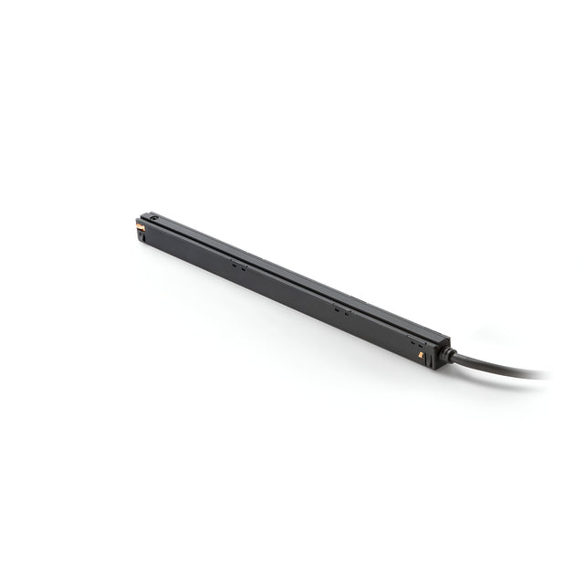 A sleek, long, and thin black Luxeon Constant Voltage Magnetic LED Driver with a cable extending from one end rests on a plain white background.