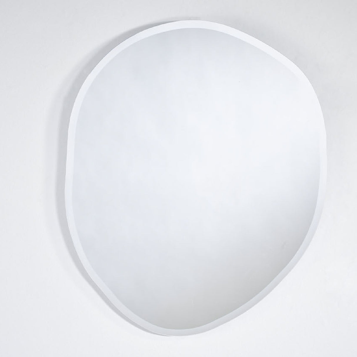 Pure Bevelled Edge Organic Wall Mirror 78cm, frameless glass mirror in a soft irregular pebble shape with a wide bevelled edge, shown against a plain white background.