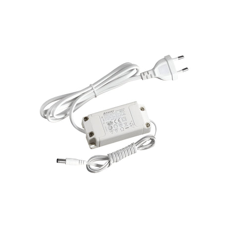 The Nocturne Constant Voltage LED Driver - 12W, 24V is a white power adapter with an attached cable and a Europlug (Type C) connector. It operates at 24V to provide constant voltage for reliable performance. Its surface displays several specifications and icons that indicate essential electrical details.