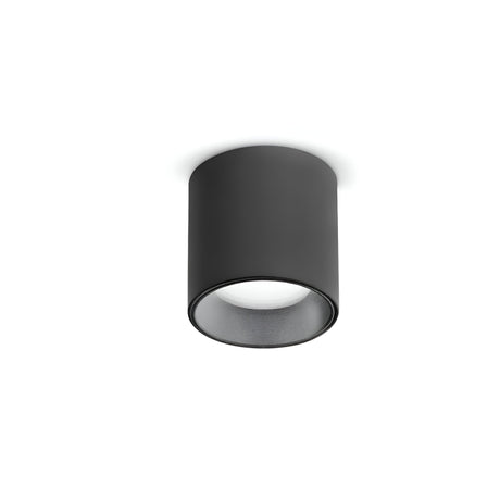 The elegant Solace LED Round Downlight 4W 3000K in black, crafted from powder-coated aluminum, is mounted on a white ceiling. It emits a gentle glow downward thanks to its energy-efficient LED technology.