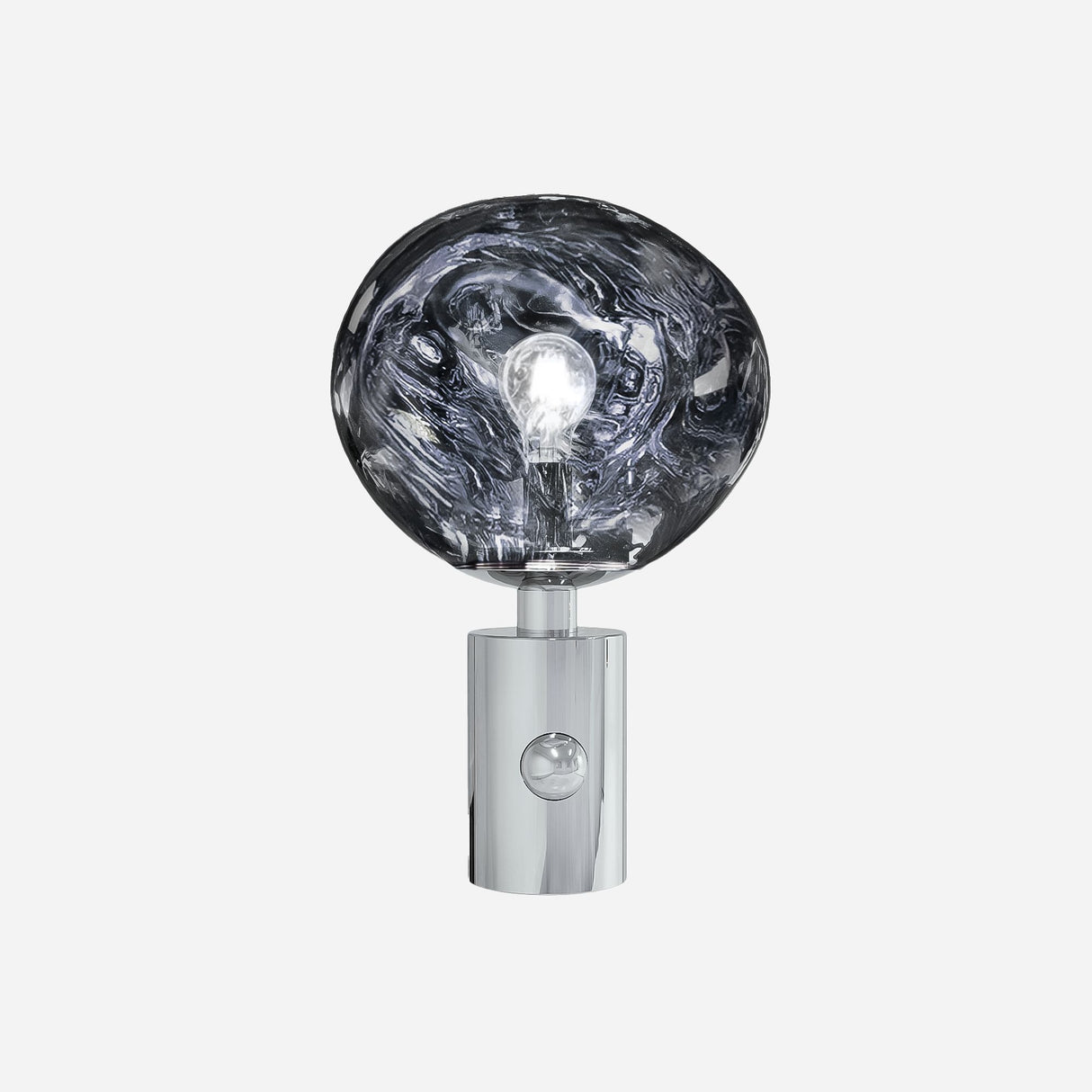 The Ex-Display Lava Table Lamp - Silver is a contemporary lighting piece with a shiny, cylindrical chrome base and a large, uniquely shaped clear glass bulb that showcases the lightbulb within—all set against a plain white background.
