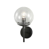 Global 1 Light Wall Light 15cm with clear round glass globe shade, exposed bulb, and black metal stem and backplate on a plain white background.