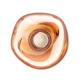 Top view of the Lava Small LED Wall & Ceiling Light in copper—a rounded, abstract design with smooth, uneven edges, a glossy amber-copper finish, and a central white circle reminiscent of molten glass.