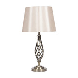 Jenna table lamp, 58cm, with an antique brass twisted spiral base and round foot, topped by a cream tapered fabric shade, shown on a plain white background.