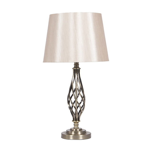 Jenna table lamp, 58cm, with an antique brass twisted spiral base and round foot, topped by a cream tapered fabric shade, shown on a plain white background.