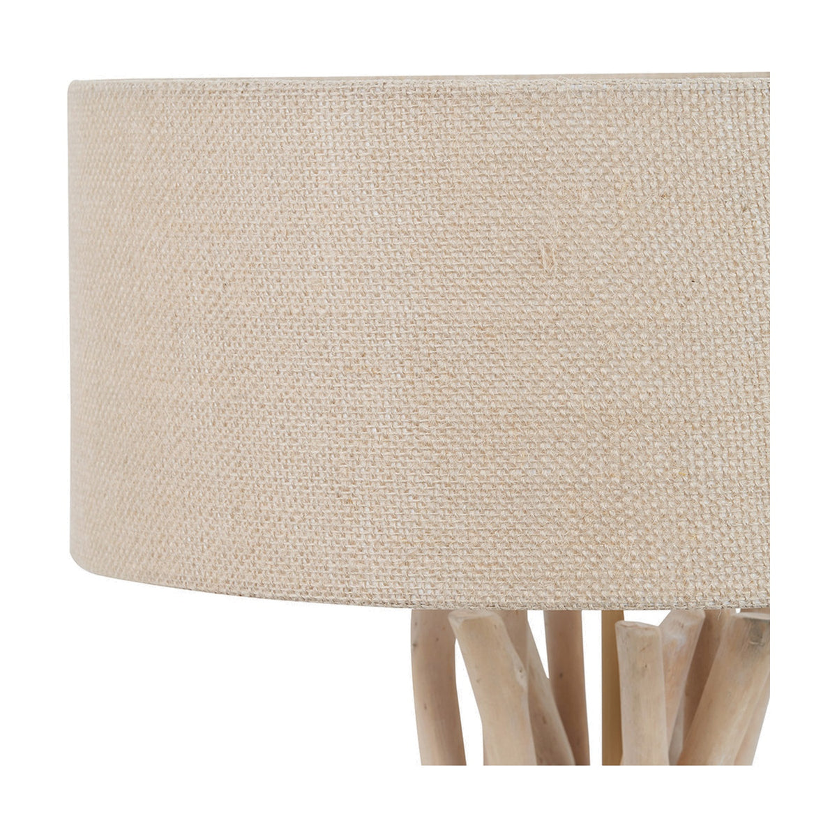 Close-up of the Derna Table Lamp's natural jute drum shade with visible woven texture, set atop a driftwood base with irregular, sculptural wood pieces.