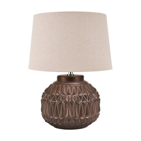 Anneli Bronze Aztec Texture Ceramic Table Lamp, 40cm, with a geometric faceted round base and a cream linen tapered shade, shown on a plain white background.