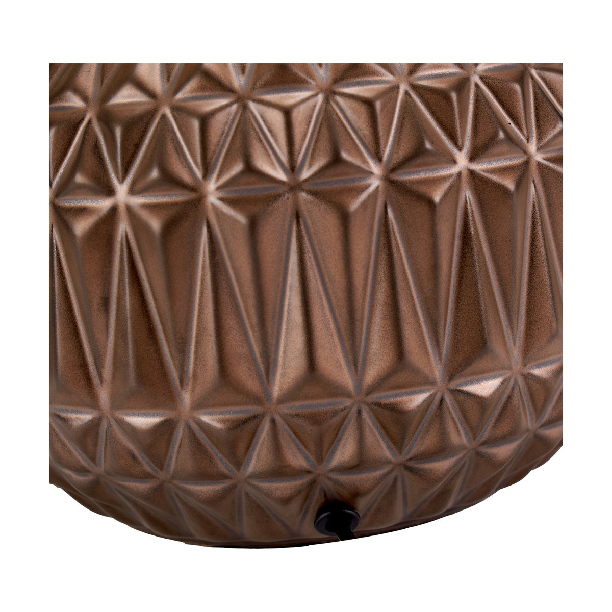 Close-up of the Anneli ceramic table lamp base in bronze, showing a moulded geometric Aztec-inspired texture with triangular facets.