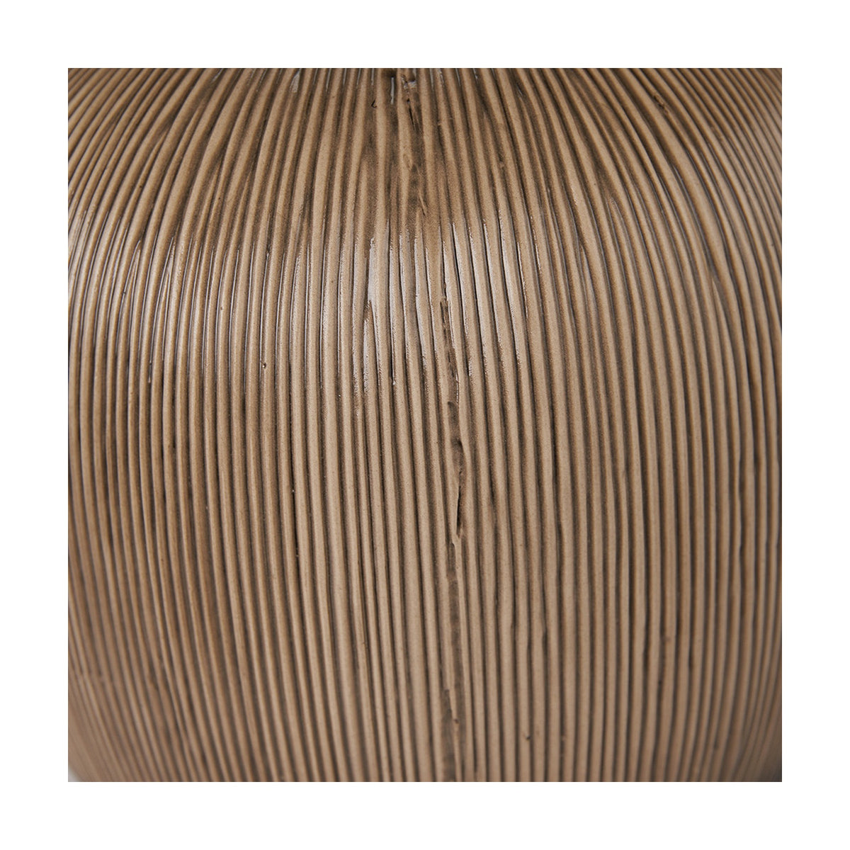 Close-up of the Greta Brown & Black Textured Ceramic Table Lamp base, showing ridged vertical texture in a warm brown finish.