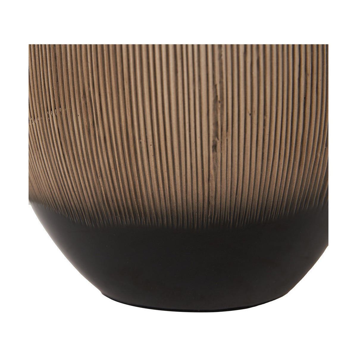 Close-up of the Greta table lamp base showing ribbed brown ceramic texture transitioning into a matte black rounded foot, on a plain white background.
