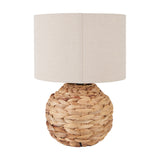 Zadi Natural Plaited Water Hyacinth Table Lamp, 41cm, with a round woven base and a plain cylindrical linen shade, shown on a white background.