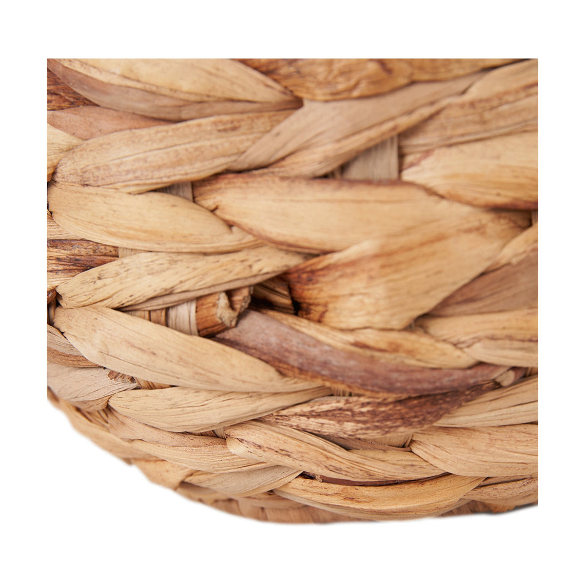 Close-up of the Zadi Natural Plaited Water Hyacinth Table Lamp base, showing tightly braided natural fibre in a herringbone weave pattern with tonal variation.