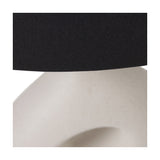 Close-up of the Ulla Monochrome Cream Organic Ceramic Table Lamp, showing the black linen drum shade edge above the smooth cream ceramic base's sculpted curve.