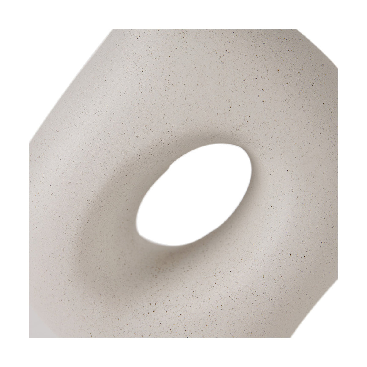 Close-up of the Ulla Monochrome Cream Organic Ceramic Table Lamp base, showing its speckled cream ceramic finish and sculptural cut-out detail on a white background.