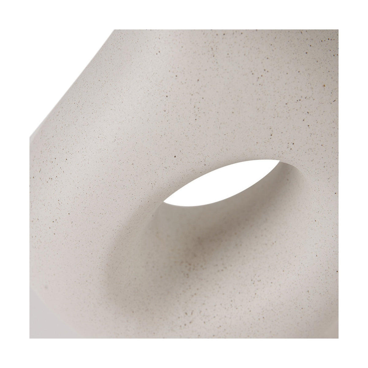 Close-up of the Ulla Monochrome Cream Organic Ceramic Table Lamp, showing the speckled cream ceramic surface with a curved cut-out detail.