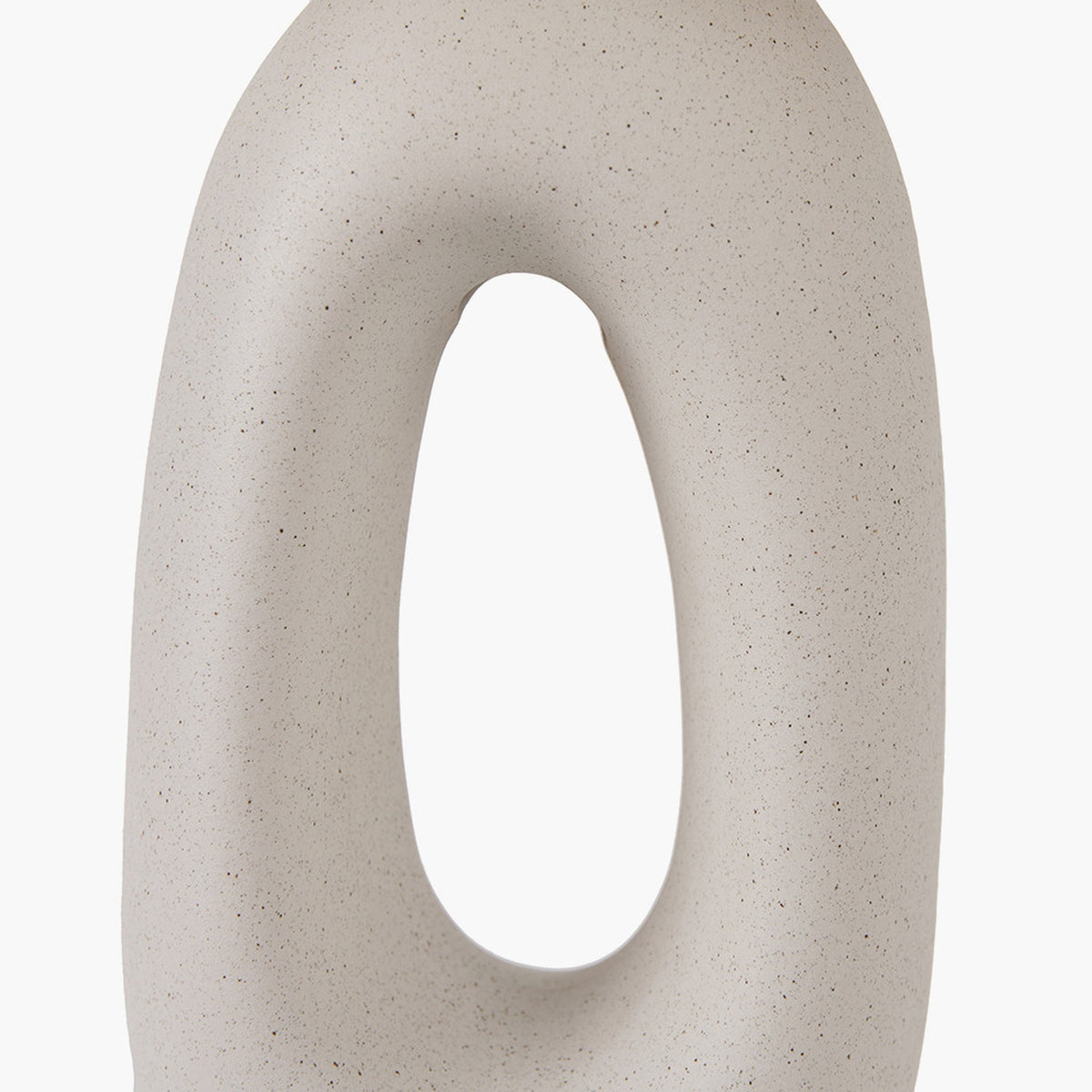 Close-up of the Laila Natural Beige Organic Tall Ceramic Table Lamp base, showing a speckled beige ceramic finish with a tall oval cut-out, against a plain white background.