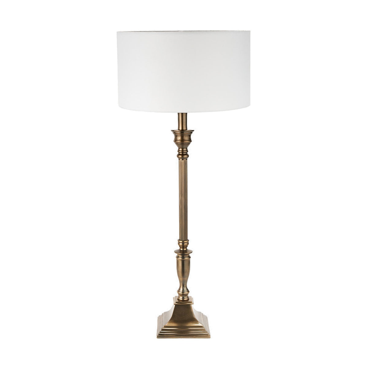 Canterbury Antique Brass Table Lamp with fluted metal column, square stepped base, and white drum shade, shown on a plain white background.