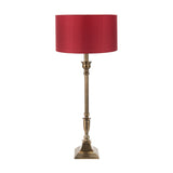 Canterbury Antique Brass Table Lamp, 70cm, with turned metal column and square stepped base, shown with a red drum shade on a plain white background.