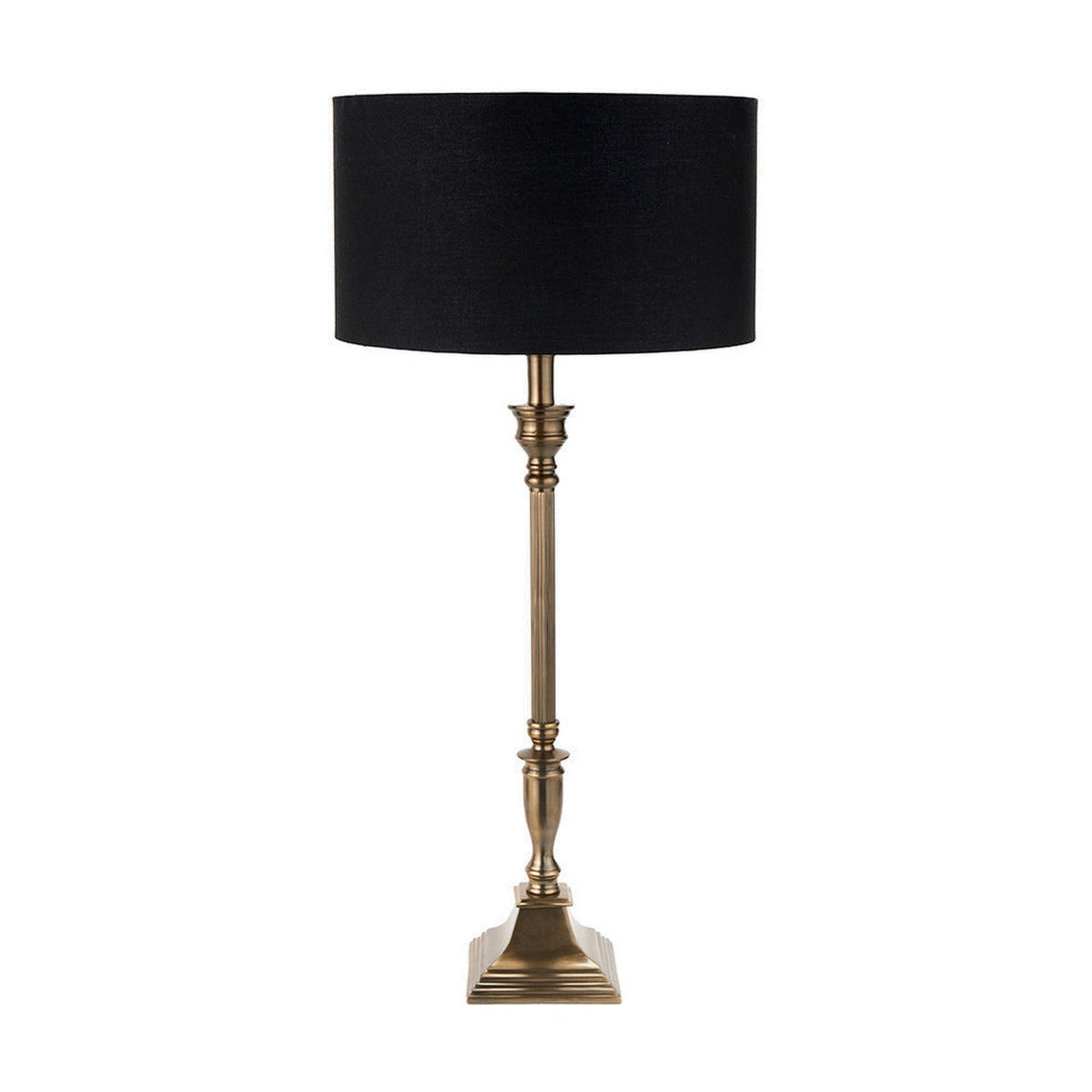 Canterbury Antique Brass Table Lamp with black drum shade, tall fluted metal stem and square stepped base, shown on a plain white background.