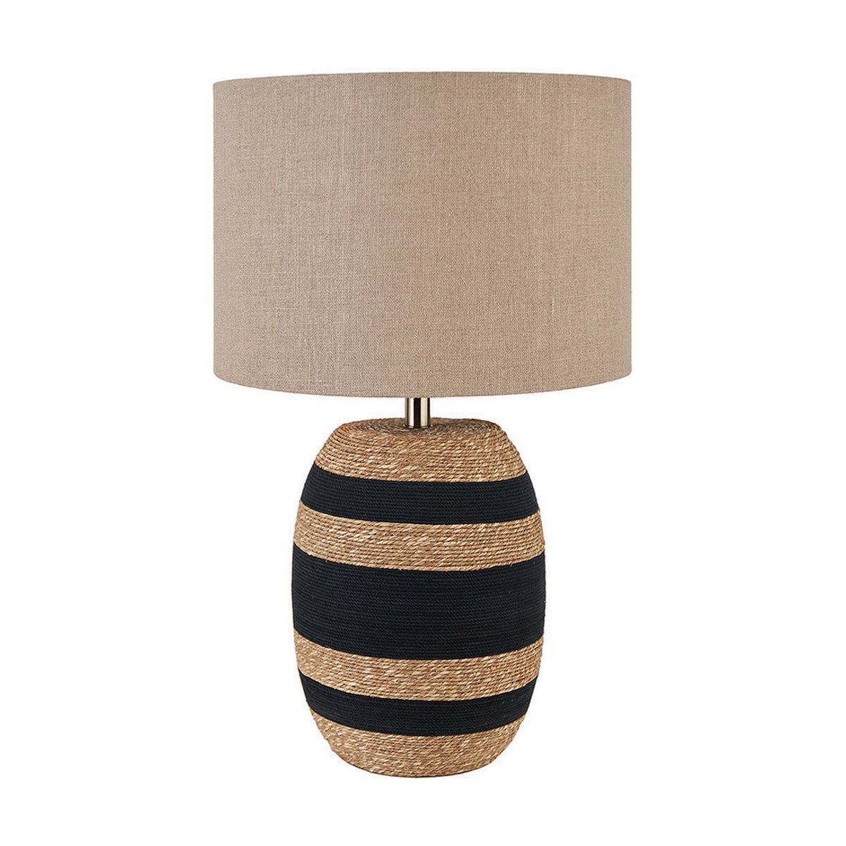 Kalutara Tall Table Lamp with woven sea grass base in black and natural stripes, brass-tone neck, and drum-shaped natural linen shade on a plain white background.