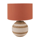 Talalla table lamp with a round striped beige and natural sea grass base and a terracotta drum shade, shown on a plain white background.