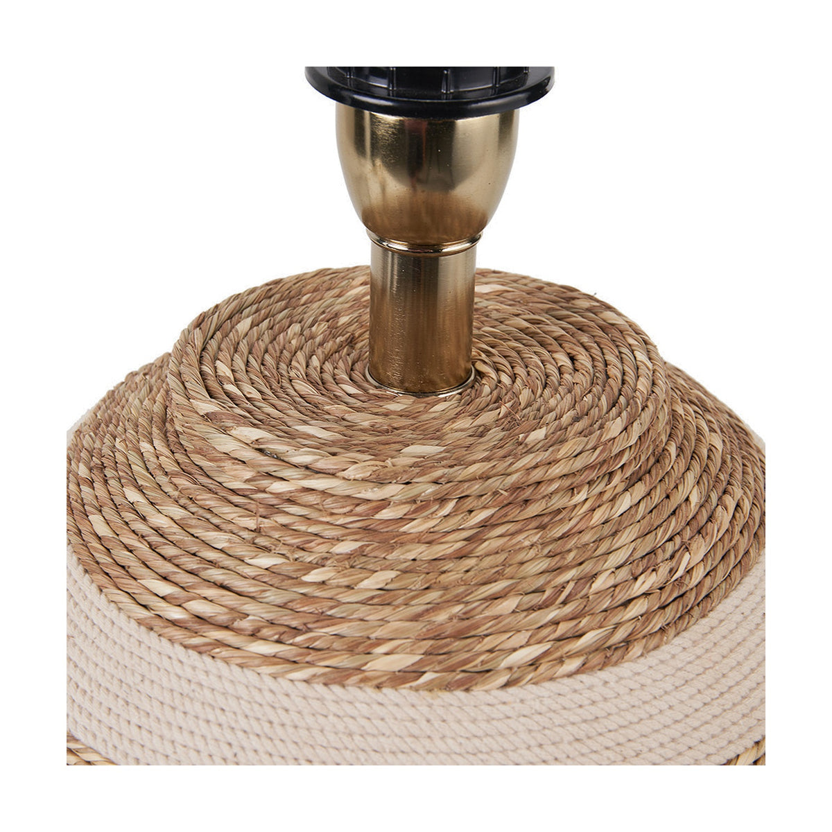 Close-up of the Talalla table lamp base showing woven natural sea grass coiling around a brushed brass stem, with beige braided rope trim on the base.