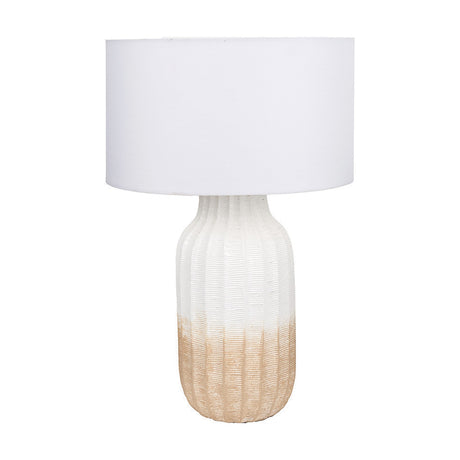 Amalia table lamp with a ribbed ceramic base in white-to-natural ombre and a wide ivory drum shade, shown on a plain white background.
