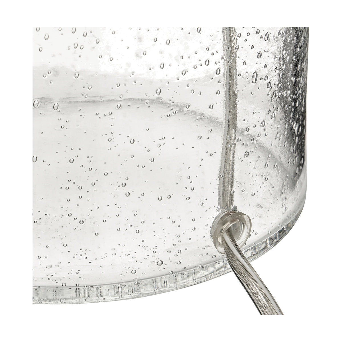 Close-up of the Bellamy Clear Bubble Glass Table Lamp base, showing bubbled clear glass texture and a curved metal hook detail.
