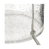 Close-up of the Bellamy Clear Bubble Glass Table Lamp base, showing bubbled clear glass texture and a curved metal hook detail.