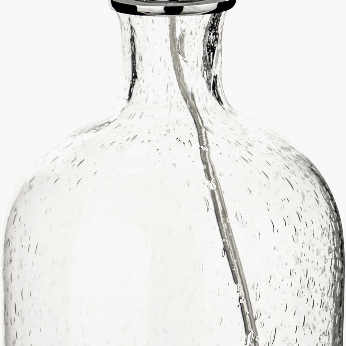 Close-up of the Bellamy Clear Bubble Glass Table Lamp base, showing textured bubble glass with a chrome neck and fitting on a plain white background.